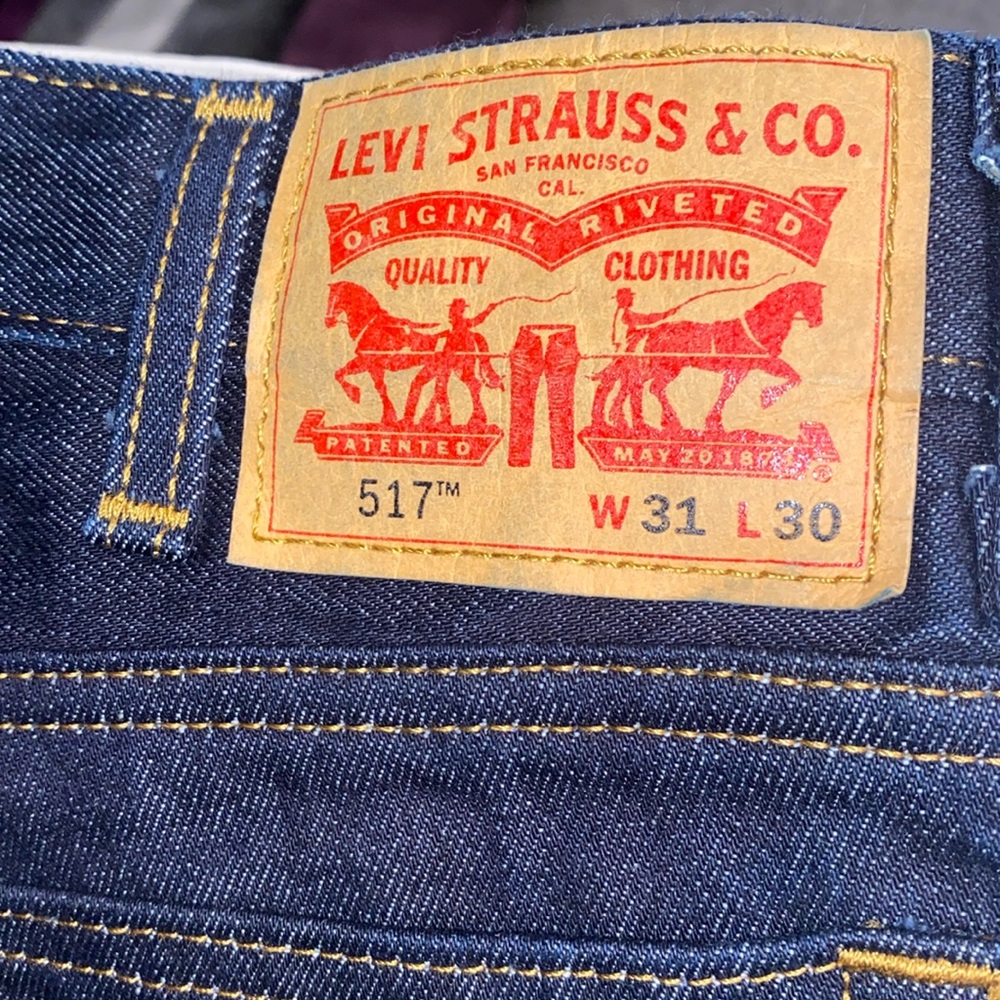 Levi’s Dark Blue Denim with brown stitching in great condition